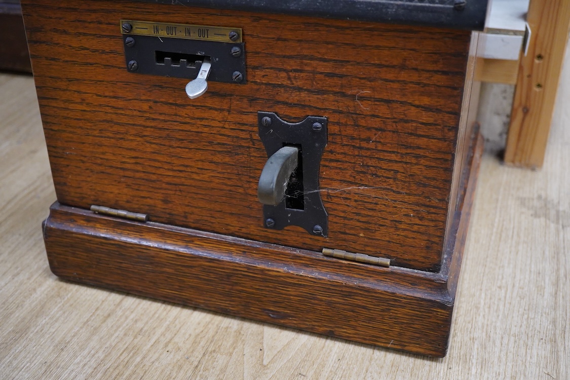 A National Time Recorder Co. Ltd. clocking in clock, 109cm high